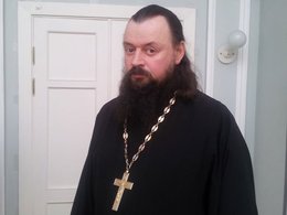 Священник Андрей Зизо