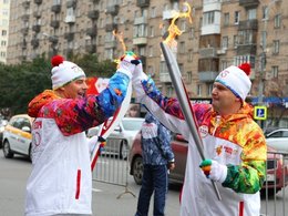 Министр финансов с олимпийским огнем. Фото: Минфин России