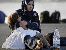 Сирийская беженка с ребенком