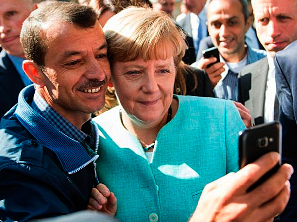А.Меркель среди мигранов