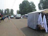 Палатка со школьной формой на рынке в райцентре. Август 2016
