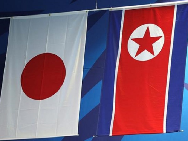 Флаги Японии и КНДР