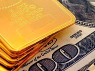 Слитки золота и долларовая купюра