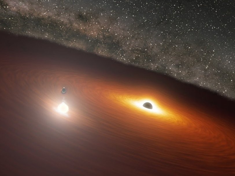 Рисунок, иллюстрирующий прохождение малой черной дыры через аккреционный диск большой в двойной системе сверхмассивных черных дыр